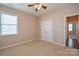 Bedroom with double door closet and window with blinds at 152 Suggs Mill Dr, Mooresville, NC 28115