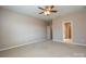 Spacious bedroom with ceiling fan and neutral carpeting at 152 Suggs Mill Dr, Mooresville, NC 28115