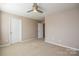 Spacious bedroom with ceiling fan and neutral wall colors at 152 Suggs Mill Dr, Mooresville, NC 28115