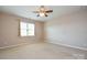 Bright bedroom with window and ceiling fan at 152 Suggs Mill Dr, Mooresville, NC 28115