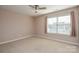 Bright bedroom with ceiling fan and neutral carpet at 152 Suggs Mill Dr, Mooresville, NC 28115
