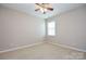 Spacious bedroom with ceiling fan and window at 152 Suggs Mill Dr, Mooresville, NC 28115