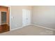 Bedroom with double door closet and neutral wall colors at 152 Suggs Mill Dr, Mooresville, NC 28115