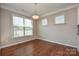 Bright dining area with hardwood floors and a large window at 152 Suggs Mill Dr, Mooresville, NC 28115