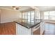 Large kitchen island with a double sink, dishwasher, and granite countertop at 152 Suggs Mill Dr, Mooresville, NC 28115