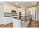 Modern kitchen with white cabinets, granite countertops, and stainless steel appliances at 152 Suggs Mill Dr, Mooresville, NC 28115