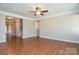 Open living room featuring hardwood floors and a ceiling fan at 152 Suggs Mill Dr, Mooresville, NC 28115