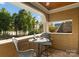 Outdoor balcony with chairs, a table, and a lake view surrounded by trees at 155 Union Chapel Dr, Mooresville, NC 28117