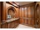 Detailed bar with wood paneling, tile floors, granite countertop, and custom design at 155 Union Chapel Dr, Mooresville, NC 28117