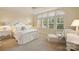 Bright bedroom with neutral carpet, a large window, white furniture, and lots of natural light at 155 Union Chapel Dr, Mooresville, NC 28117