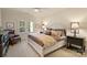 Bedroom with neutral carpet, a white bed frame, shutters, and two end tables at 155 Union Chapel Dr, Mooresville, NC 28117