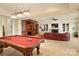 Spacious game room with a billiard table and a comfortable seating area with a fireplace at 155 Union Chapel Dr, Mooresville, NC 28117