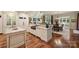 Open-concept kitchen featuring an island, wood floors, and access to the dining and living areas at 155 Union Chapel Dr, Mooresville, NC 28117