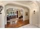 Open-concept living room with hardwood floors, fireplace, and abundant natural light at 155 Union Chapel Dr, Mooresville, NC 28117