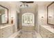 Bright bathroom featuring double vanities, soaking tub, and walk-in shower at 155 Union Chapel Dr, Mooresville, NC 28117