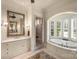 Luxurious main bathroom with soaking tub, double vanity, and separate glass shower at 155 Union Chapel Dr, Mooresville, NC 28117