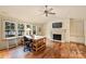 Bright office features hardwood floors, a fireplace, a ceiling fan and a large window view at 155 Union Chapel Dr, Mooresville, NC 28117