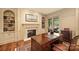 Elegant home office with custom built-ins, fireplace, and large wooden desk at 155 Union Chapel Dr, Mooresville, NC 28117