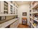 Walk-in pantry with ample shelving for storage and granite countertops at 155 Union Chapel Dr, Mooresville, NC 28117