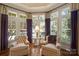 Cozy sitting room with large windows, shutters, and hardwood floors at 155 Union Chapel Dr, Mooresville, NC 28117