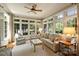 Sunroom features serene water views and comfortable seating area at 155 Union Chapel Dr, Mooresville, NC 28117