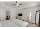 Main bedroom with ceiling fan, ensuite bathroom access, and built-in dresser at 2411 Morningside Dr, Lancaster, SC 29720