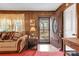 Inviting entryway with wood paneling, a view of the backyard, and a charming door at 3015 Pageland Hwy, Lancaster, SC 29720