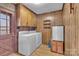 Convenient laundry room with washer, dryer, and extra storage at 3015 Pageland Hwy, Lancaster, SC 29720