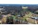Aerial view of a spacious lot, surrounded by mature trees at 3021 Tryon Courthouse Rd, Bessemer City, NC 28016