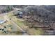 A wide aerial view shows the property layout, lot dimensions, and proximity to a paved road at 3021 Tryon Courthouse Rd, Bessemer City, NC 28016