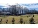 Beautiful backyard view showcasing mature trees and space for outdoor recreation at 3021 Tryon Courthouse Rd, Bessemer City, NC 28016