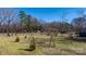 Spacious yard featuring mature trees and plenty of room for outdoor activities at 3021 Tryon Courthouse Rd, Bessemer City, NC 28016