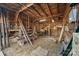 Barn interior with wood beams and unfinished floor at 3021 Tryon Courthouse Rd, Bessemer City, NC 28016
