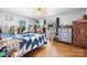 Bedroom featuring hardwood floors, two windows, and neutral paint at 3021 Tryon Courthouse Rd, Bessemer City, NC 28016