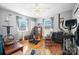 Bedroom featuring two windows, hardwood floors, and ceiling fan at 3021 Tryon Courthouse Rd, Bessemer City, NC 28016