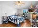 Bedroom features hardwood floors, one window, and neutral paint at 3021 Tryon Courthouse Rd, Bessemer City, NC 28016