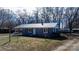 Charming home with a metal roof, well-maintained lawn, and attached carport at 3021 Tryon Courthouse Rd, Bessemer City, NC 28016