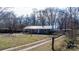 Attractive one-story house with a metal roof and a large front yard at 3021 Tryon Courthouse Rd, Bessemer City, NC 28016