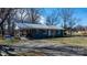 A cozy home showcasing its carport, offering sheltered parking and additional outdoor space at 3021 Tryon Courthouse Rd, Bessemer City, NC 28016