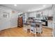 Bright kitchen features a center island, wood floors, and stainless steel refrigerator at 3021 Tryon Courthouse Rd, Bessemer City, NC 28016