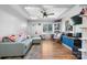 This stylish living room is bright and airy, with hardwood flooring and modern decor at 3021 Tryon Courthouse Rd, Bessemer City, NC 28016