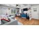 Inviting living room featuring hardwood floors, a ceiling fan, and a sunlit window at 3021 Tryon Courthouse Rd, Bessemer City, NC 28016