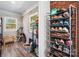 Mud room features wood look floors and shoe rack at 3021 Tryon Courthouse Rd, Bessemer City, NC 28016