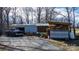 Functional outbuildings including storage sheds and a woodshed, enhancing property utility at 3021 Tryon Courthouse Rd, Bessemer City, NC 28016