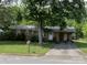 Brick ranch house with carport and mature landscaping at 312 Fulton St, Kings Mountain, NC 28086