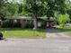 Ranch house with a carport, driveway, and green lawn at 312 Fulton St, Kings Mountain, NC 28086