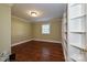 Bright bedroom with hardwood floors and built-in shelving at 3729 Carmel Acres Dr, Charlotte, NC 28226