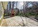 Spacious deck featuring a brick fireplace and backyard view at 3729 Carmel Acres Dr, Charlotte, NC 28226