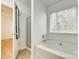 Bathroom with a large tub and a glass-enclosed shower at 4648 Madeline Dr, Rock Hill, SC 29732