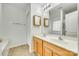 Bathroom featuring a dual sink vanity, mirror, and door at 4648 Madeline Dr, Rock Hill, SC 29732